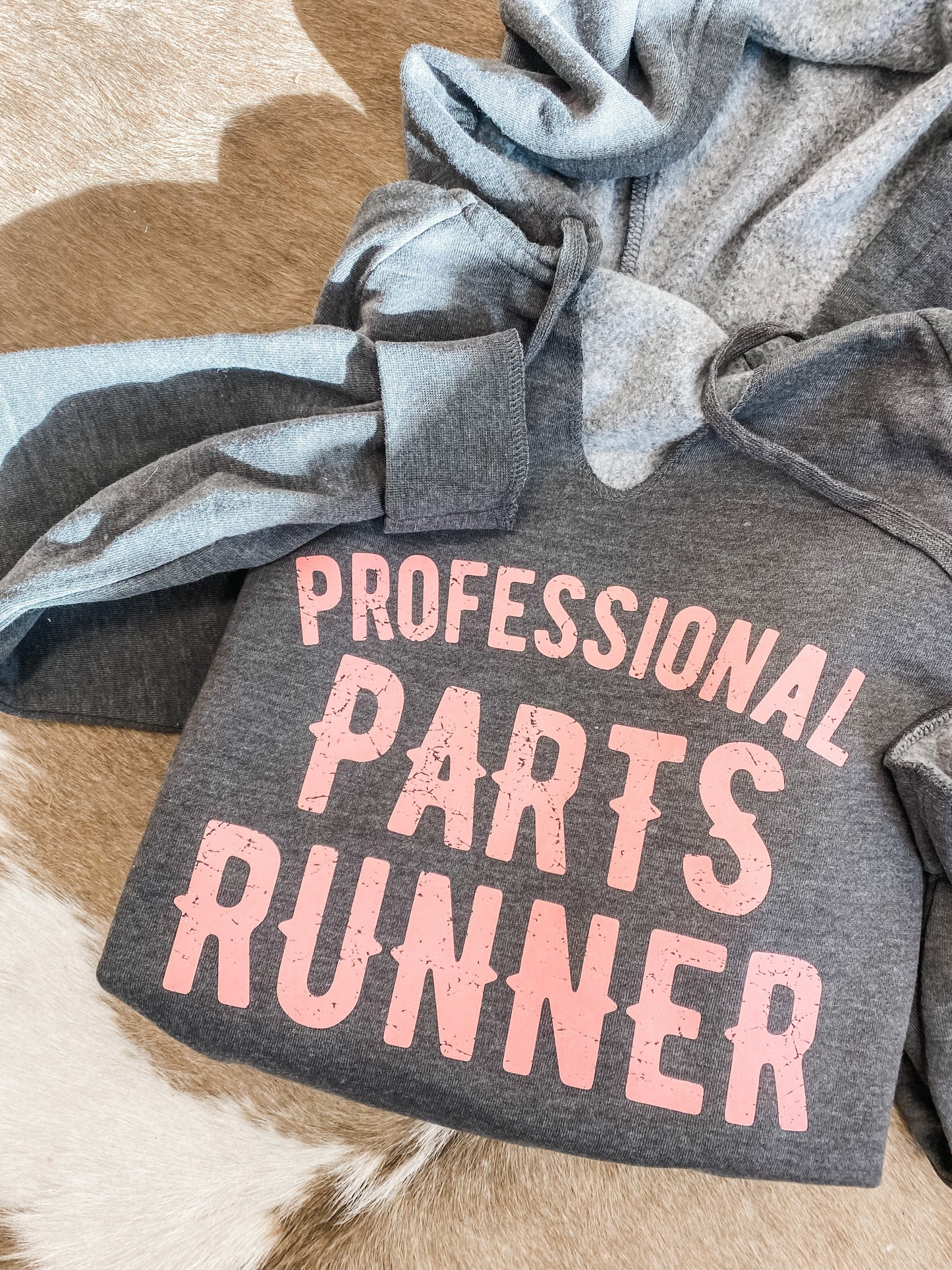 Parts Runner Hoodie captured in a striking image