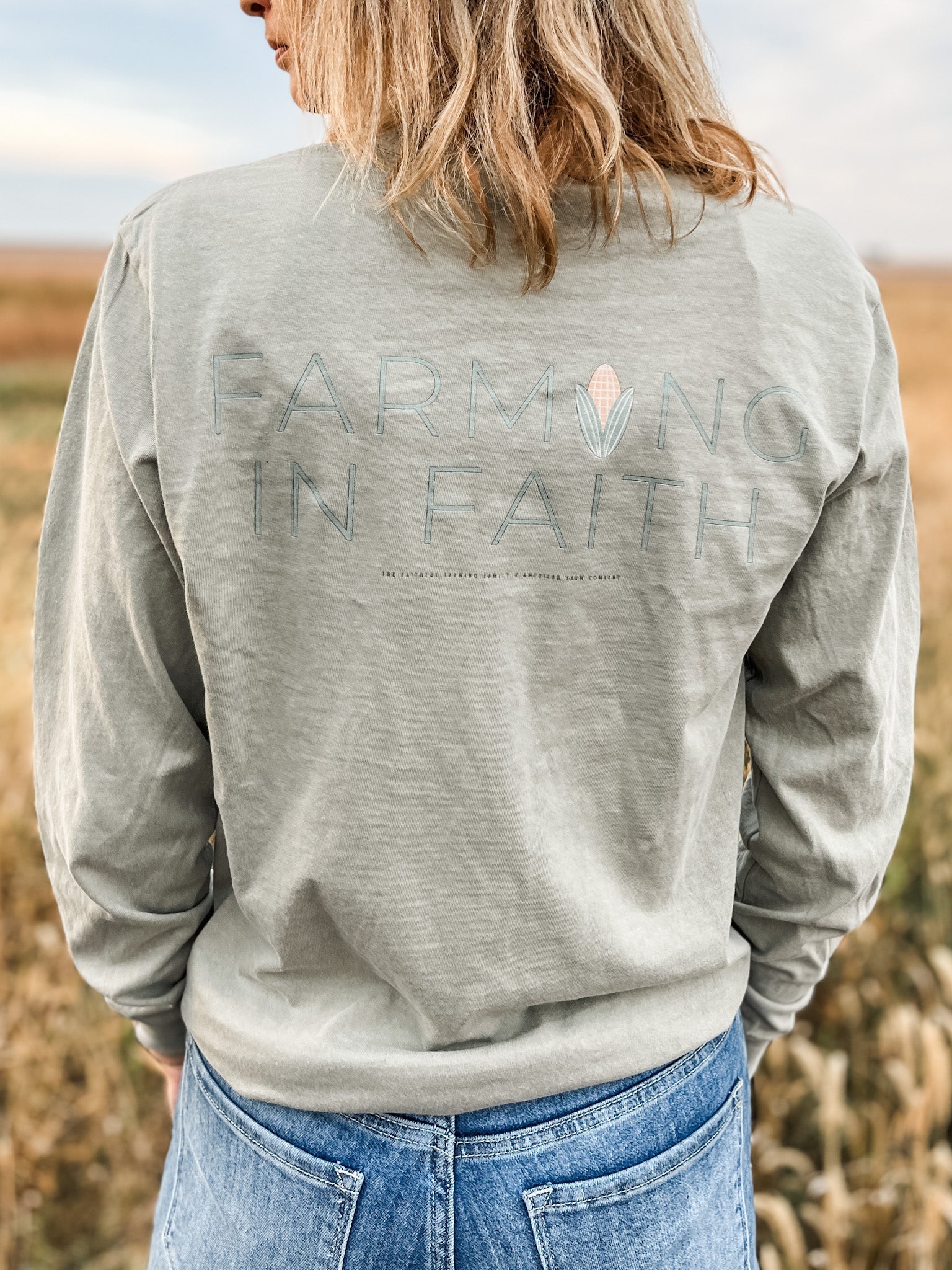 Back of farming in faith long sleeve worn by women in fields