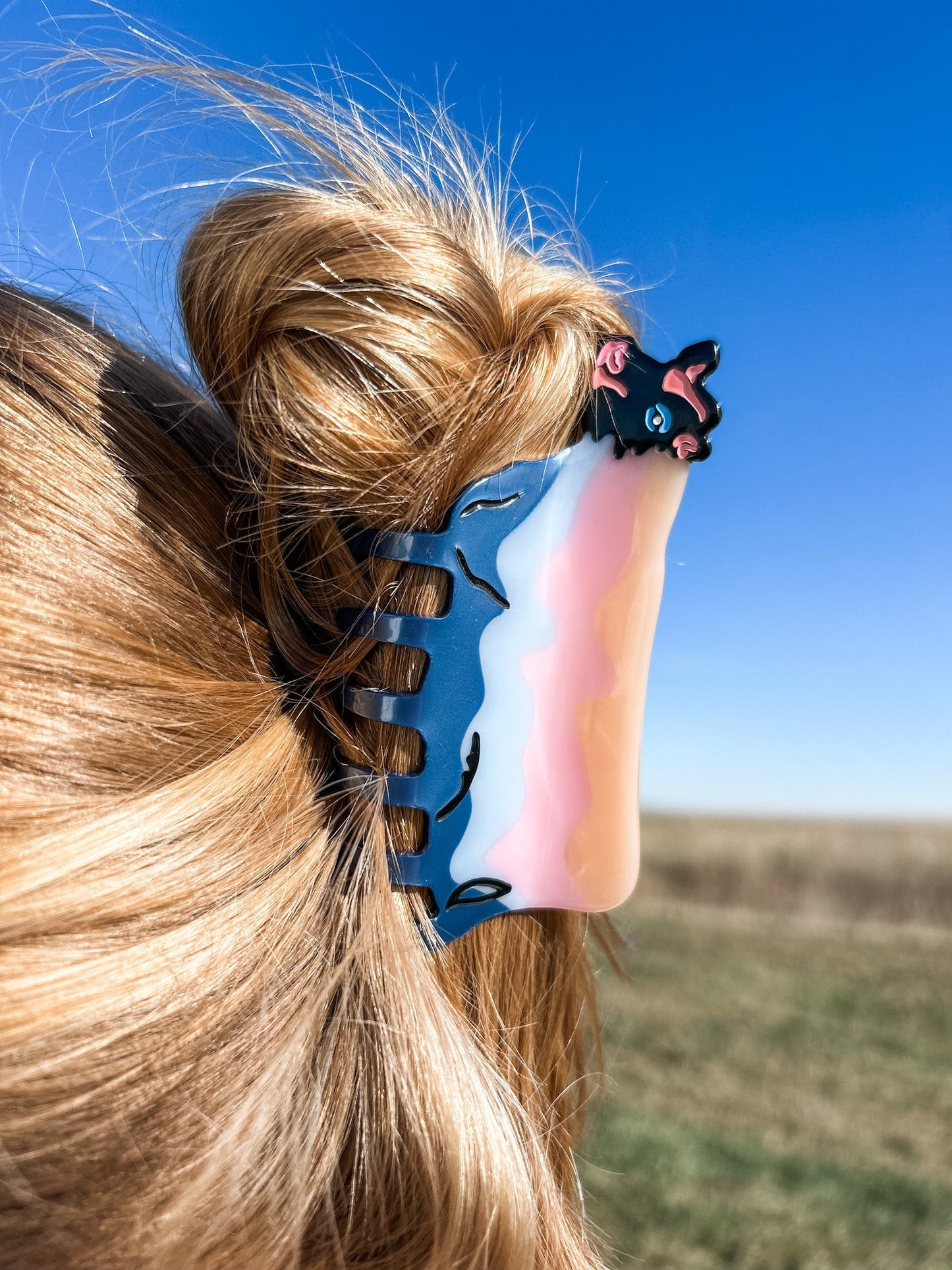 An up-close view of a woman donning a vintage Cow Hair Claw Clip in her hairstyle